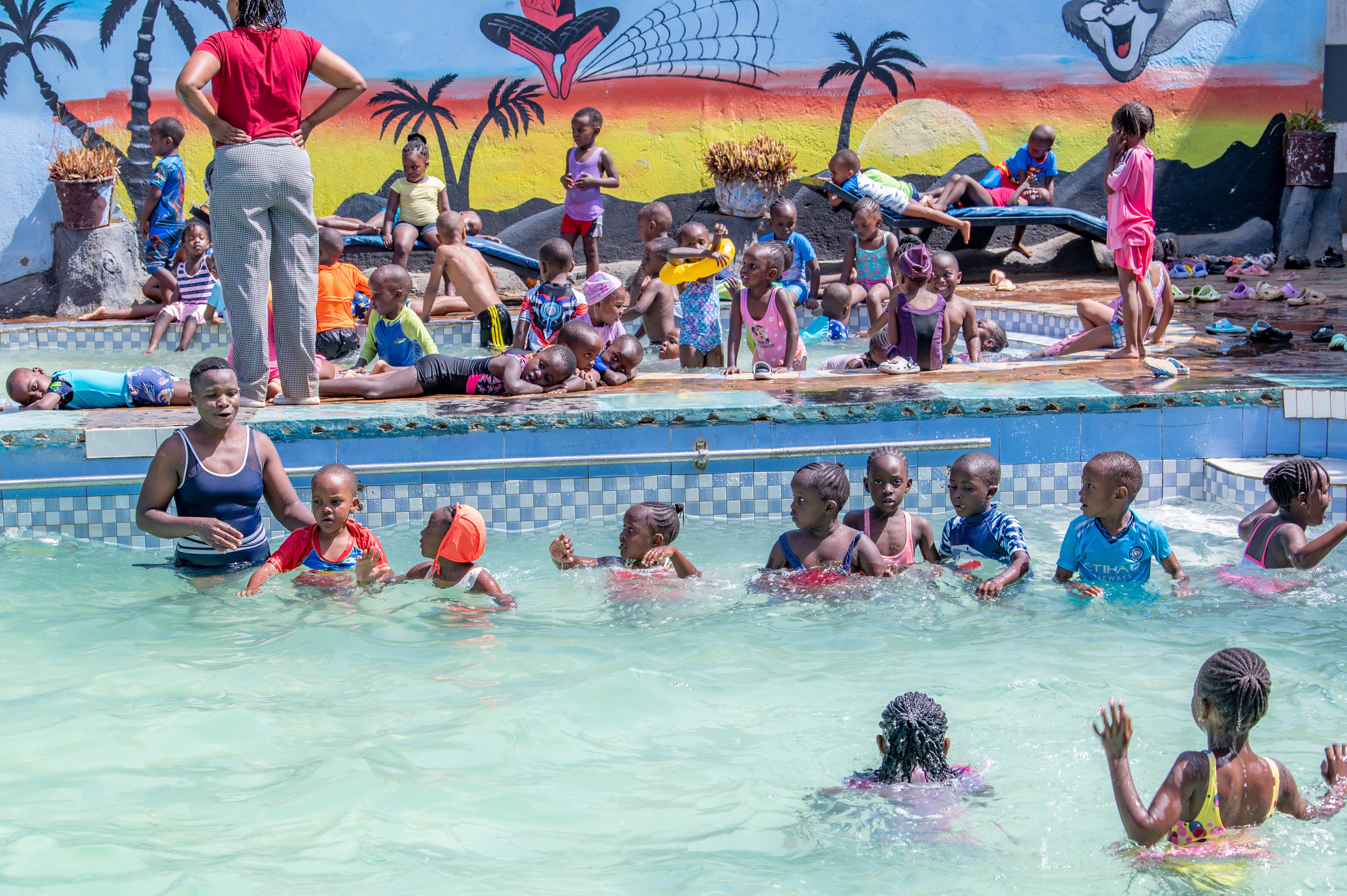 Pupils entering the swimming pool during a lesson
